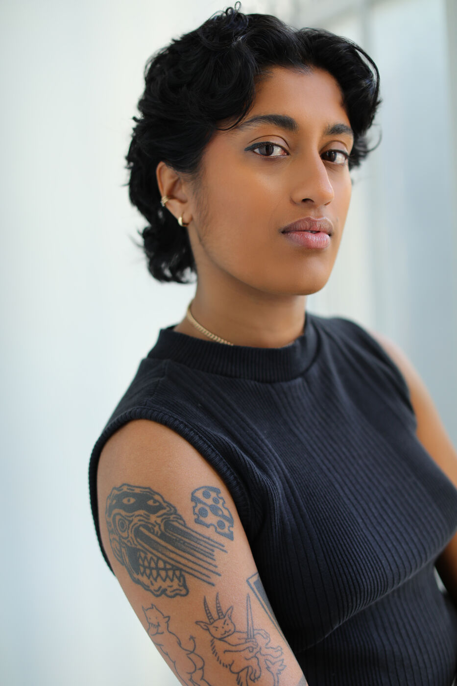 Headshot of Uma Paranjpe — black tank, three-quarter turn