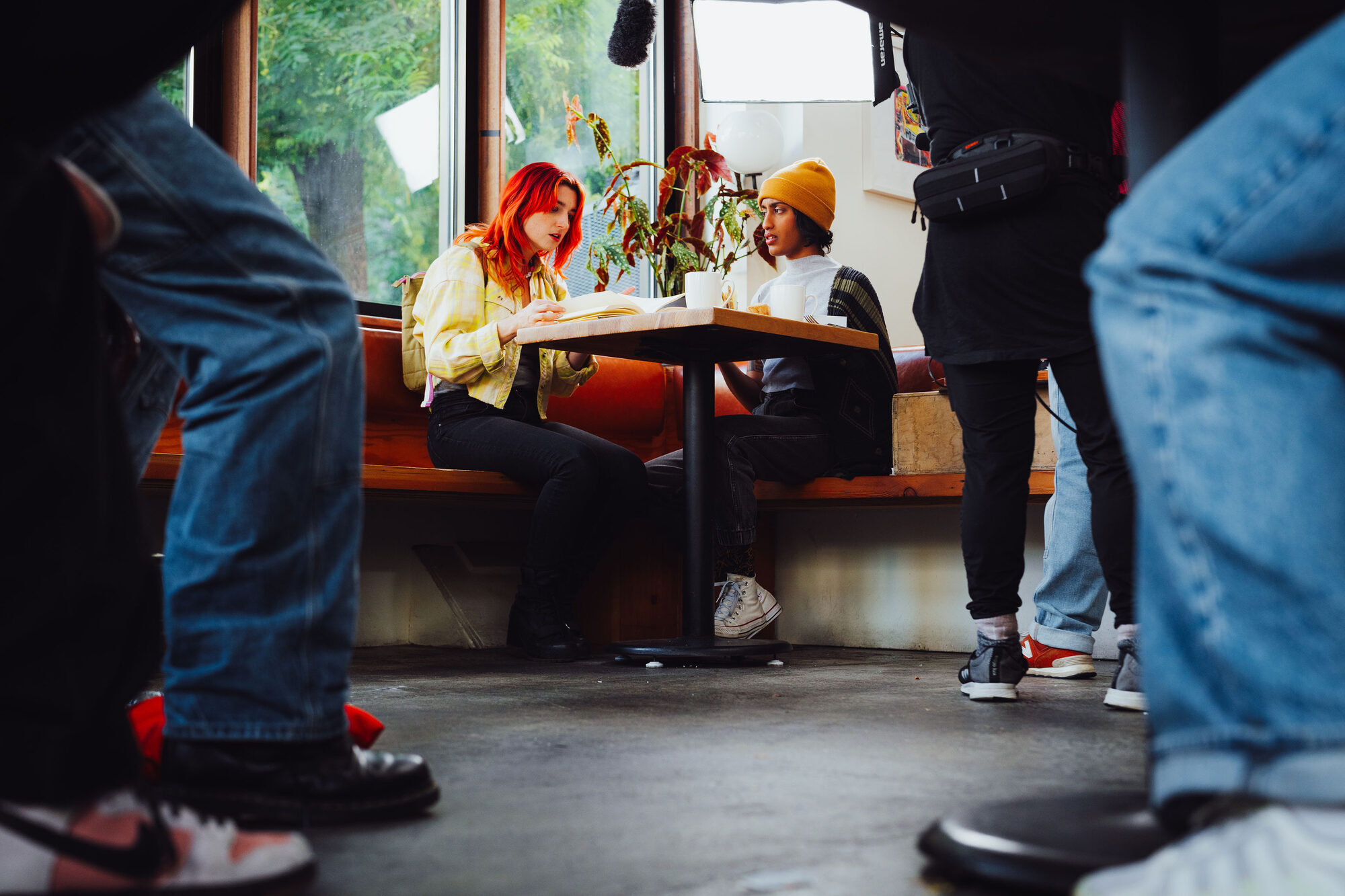 Uma performing a café scene seen from the crew's perspective