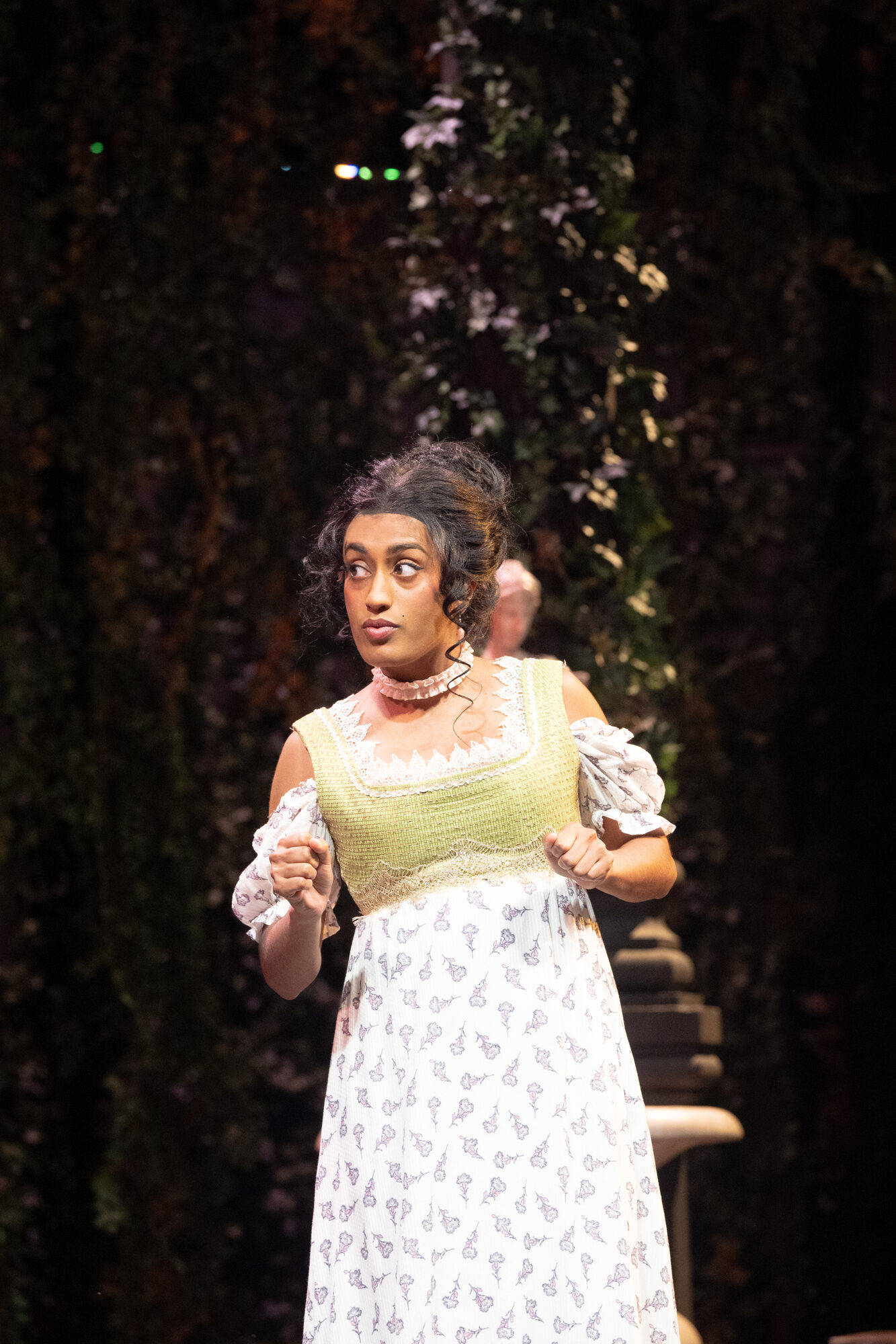 Onstage in an Empire-waist gown