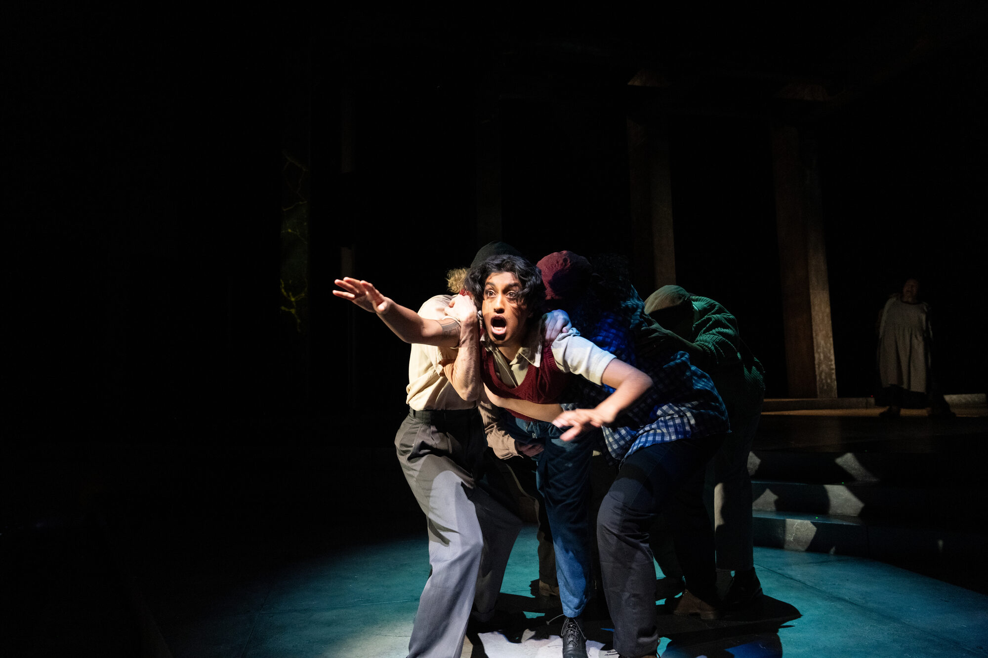 Onstage in a red knit vest