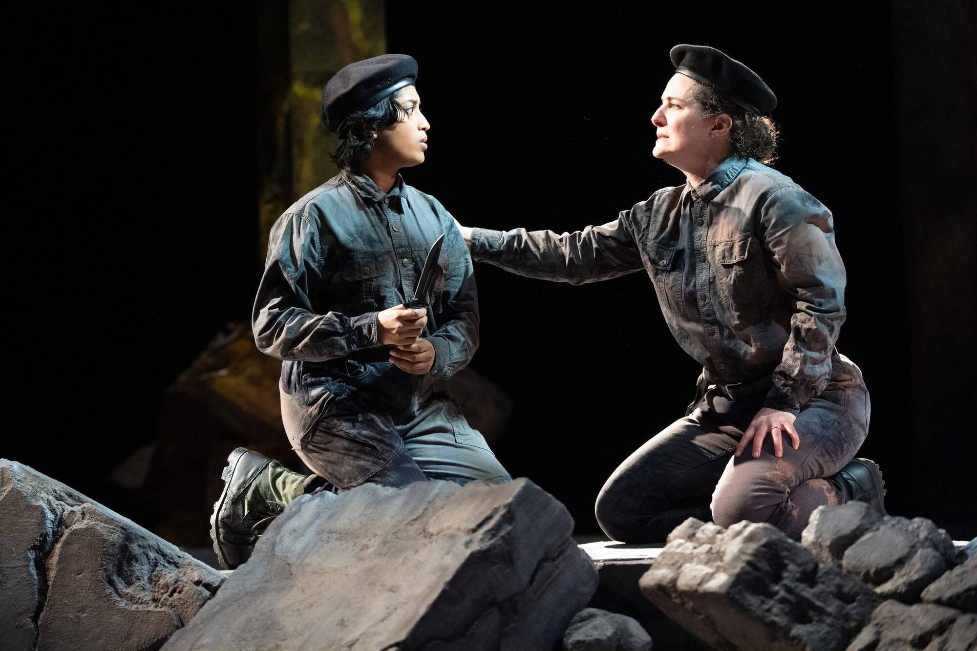 Onstage scene with two actors in berets