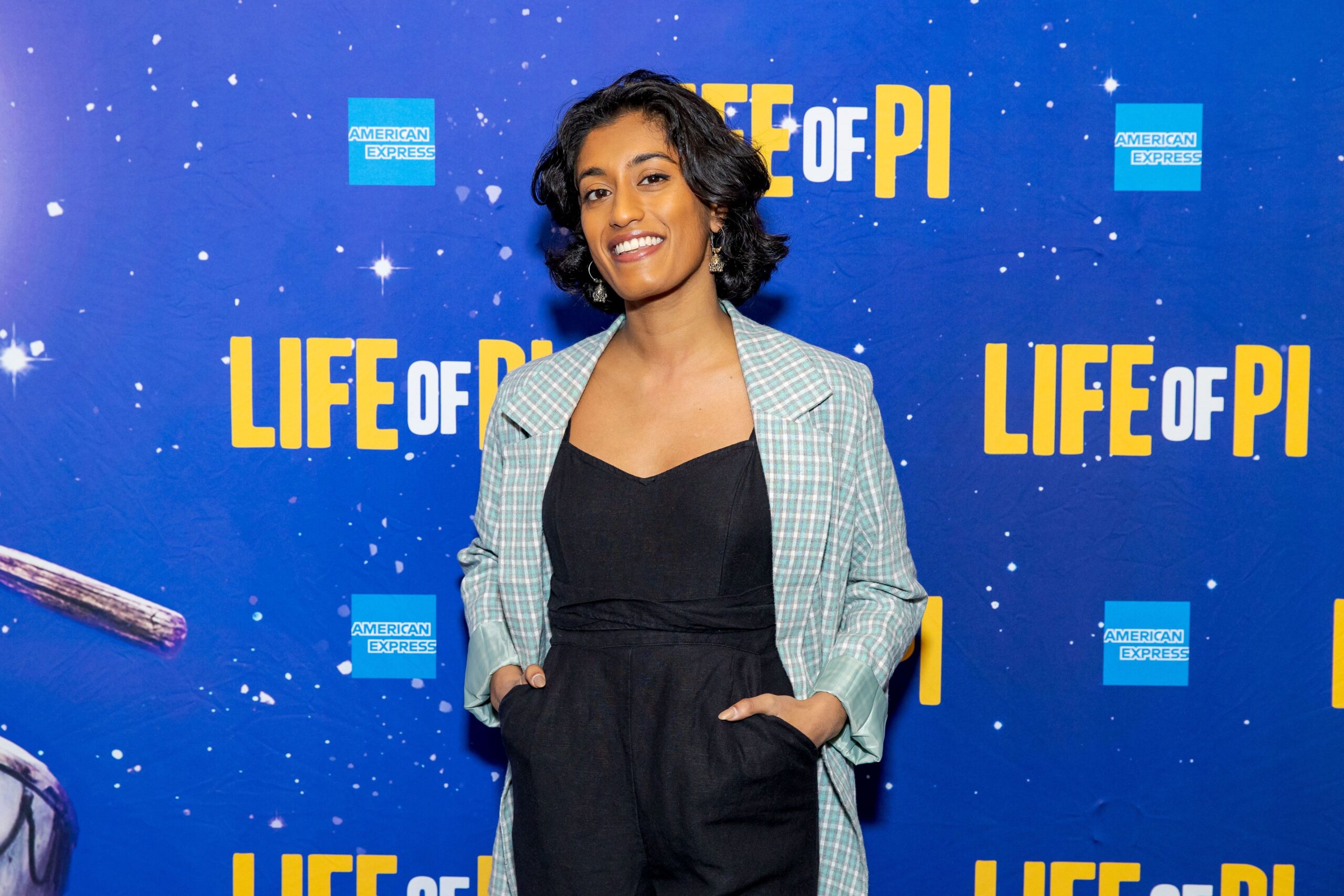 Uma in front of a press day backdrop that reads "Life of Pi"